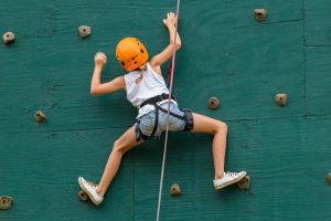 girl indoor rock climbing